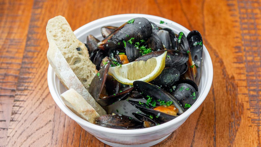 Steamed Mussels With Garlic · 1 lb.  Stream mussels cook with garlic, butter, and white wine sauce. Serve with two slices of French baguettes.