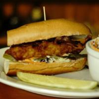Fish Sandwich · Fresh haddock, beer battered & fried topped with bacon, sliced pickles, tartar sauce & chipo...