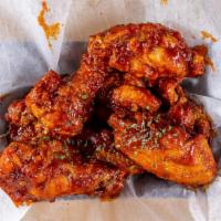 Chicken Wings · Tossed in your choice of either glazed garlic soy, honey BBQ, Sweet & Spicy Korean or Classi...