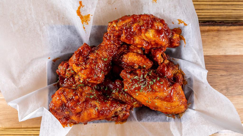 Chicken Wings · Tossed in your choice of either glazed garlic soy, honey BBQ, Sweet & Spicy Korean or Classic Buffalo with blue cheese