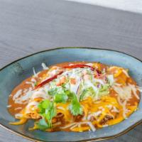 Enchiladas Rojas *Gf · Our signature red salsa topped with melted cheese
and queso fresco, green onions, diced red ...