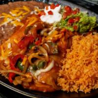 Enchiladas Rancheras *Gf · Our signature salsa topped with bell peppers,
onions, tomatoes, mushrooms, and
THE WORKS