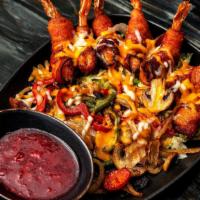 Bacon Wrapped Shrimp *Gf · Shrimp wrapped in crispy bacon, served over
grilled onions, bell peppers, tomatoes, and
mush...