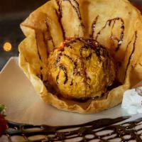 Deep Fried Icecream · Creamy vanilla ice cream enveloped in a crispy
deep-fried coating. Drizzled with strawberry ...