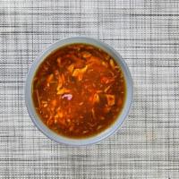 Hot Sour Soup /酸辣汤 · serving with crispy noodles on the sied