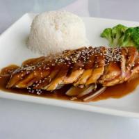 Teriyaki Chicken /照烧鸡 · Grilled chicken with onions severing with white rice on the side.