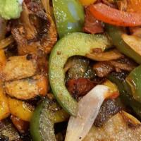 Vegetarian Fajitas · A light combination of fresh mushrooms, zucchini, squash, bell peppers, onions and tomatoes....