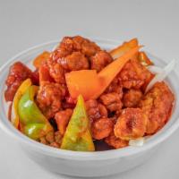 Sweet And Sour Pork 甜酸肉 · With white rice.
配白飯。