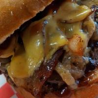 B3-Western Burger · 6 oz BURGERS* SERVED WITH  BACON, CARAMELIZED ONIONS, AMERICAN CHEESE AND BBQ SAUCE. ON BRIO...
