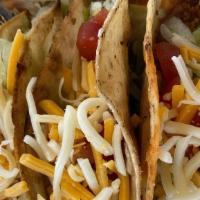 Crispy Tacos · (3) GROUND CHUCK CRISPY TACOS FILLED W/ LETTUCE, TOMATOES, SHREDDED MEXICAN CHEESE & GREEN S...