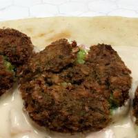 Falafel Pitawich · Mashed Chick Pease deep fried into tiny balls of perfection  - Lettuce - Arab Pickle - Tomat...