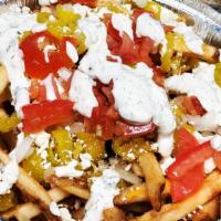 Greek Fries · Fries topped with Taziki Sauce - Feta Cheese - Red Onion - Diced Onion & Tomato - Dried Pars...