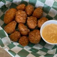 Pretzel Crusted Cheese Curds · Wisconsin Cheese Curds In A Pretzel Coating served with Stout Beer Cheese Sauce