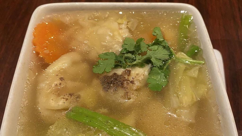 Wonton Soup · Stuffed ground shrimp and chicken with napa cabbage, celery, carrots, scallions and cilantro in clear broth.