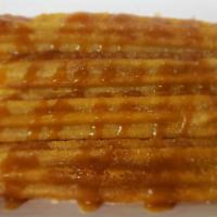 Churro · Mexican Dessert Caramel style. dusted with Cinnamon Sugar And Caramel Sauce.