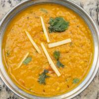Dall Tarka · Yellow lentils cooked with Himalayan herbs & Indian spices.