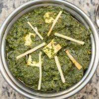 Saag Paneer · Cubes of homemade cheese with spinach & green herbs.