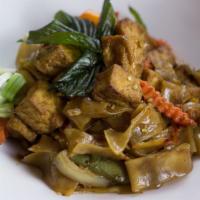 Drunken Noodle · Spicy. Vegan. Flat rice noodle in a medium spicy chili sauce with bell peppers, tomatoes, ca...