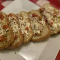 Bruschetta · Garlic bread baked and topped with fresh tomatoes, mozzarella, and basil.