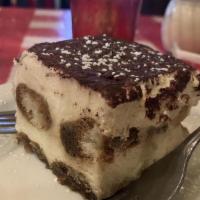 Tiramisu · Rich and creamy dessert layered with mascarpone cheese, espresso, and rum-flavored ladyfinge...