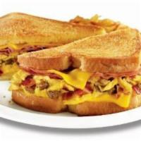 The Grand Slamwich® · Scrambled eggs, sausage, bacon, ham and American cheese on potato bread grilled with a maple...