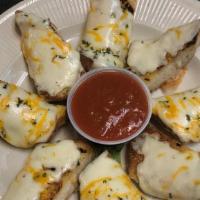 Garlic Cheese Toast · Garlic Bread topped with melted Mozzarella and Cheddar Cheeses. Served with Marinara.