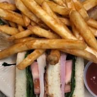 Club Sandwich · Triple decker sandwich made with turkey, ham, bacon, American Cheese, lettuce, tomato, and m...