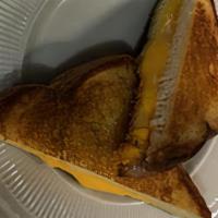 Grilled Cheese · Three pieces of American Cheese melted on white bread. Served with potato chips.