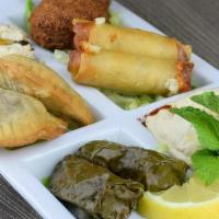 Mezza Sampler · Induldge in sampling our falafel, cheese rolls, hommous, sambousik and baba ghanouje