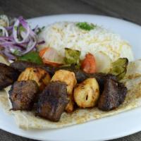 Mixed Grill · Combination of beef kabob, kafta kabob, and shish touk served with side of rice and veggies....