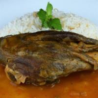 Lamb Shanks · Succulent shanks slowly cooked in tomato base sauce, served with side of rice.