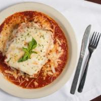 Homemade Lasagna · Five high layers of ground beef, Ricotta, Mozzarella and tomato sauce.