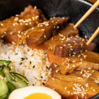 Pork Belly Don · A generous serving of our braised pork belly slices, served with tender medium grained rice,...