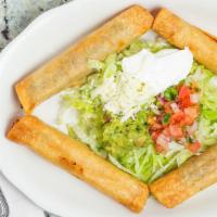 Taquitos Mexicanos · Four corn deep fried taquitos, two beef and two chicken. Served with lettuce, guacamole, tom...