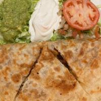 Steak Quesadilla · A flour tortilla grilled and stuffed with cheese, grilled steak or grilled chicken. Served w...