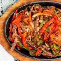 Fajitas · Tender sliced beef or chicken, grilled with onions, tomatoes and bell peppers. Served with S...