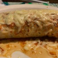 #9 Steak Burrito · A Large Burrito stuffed with steak strips, rice, beans, and  pico de gallo, covered with red...