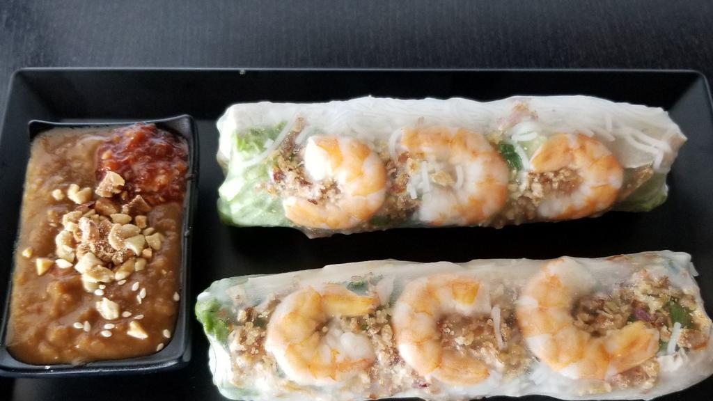 Classic Shrimp & Pork Salad Rolls · Two shrimp and pork salad rolls. Rice paper filled with steam shrimp and pork, lettuce, vermicelli, jicama, roasted onion, and peanut dipping sauce.