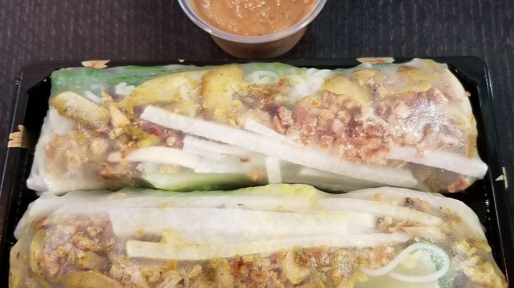 Grilled Lemongrass Chicken Salad Roll · Two salad rolls: Rice paper filled with lemongrass chicken, lettuce, vermicelli, jicama, roasted onion, and peanut dipping sauce.