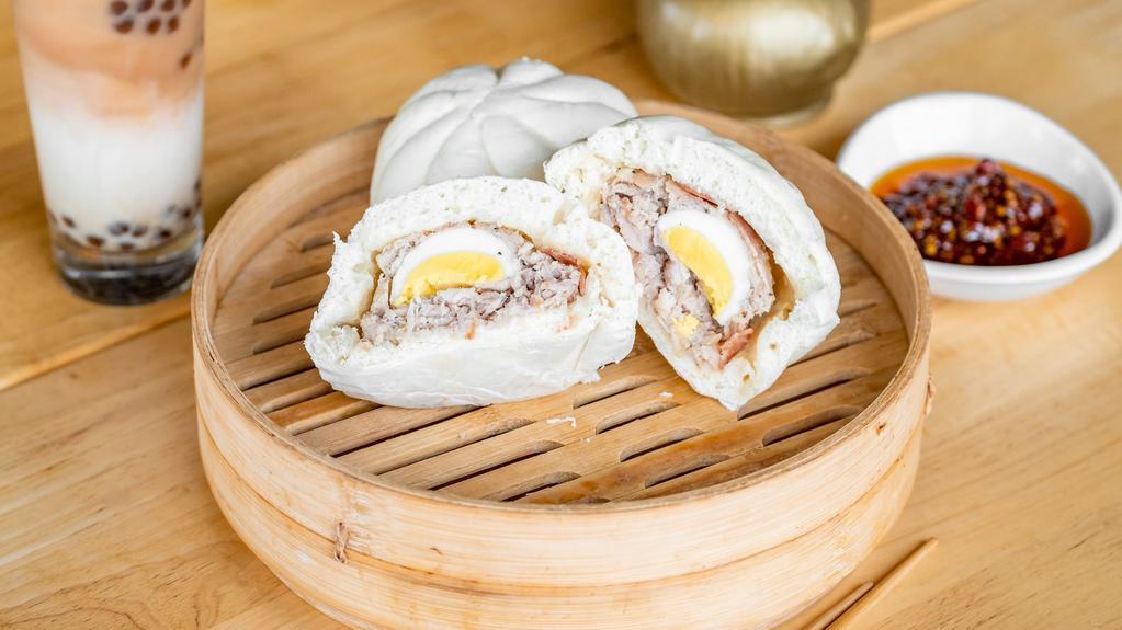 Hum Bao · Two fluffy steamed bun filled with pork, Chinese sausage, and egg.