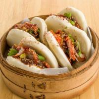 Bbq Pork Bun Wrapped · A soft and fluffy bun filled with BBQ pork, pickled carrot daikon, green onions, hoisin sauc...