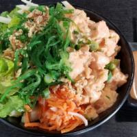 Spicy Salmon Poke Rice Bowl · Salmon with creamy spicy mayo, sea salad, lettuce, jicama, carrot & daikon pickle, roasted s...