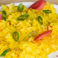 Turmeric Rice · New-crop Jasmine rice seasoned with turmeric and steam in chicken broth.