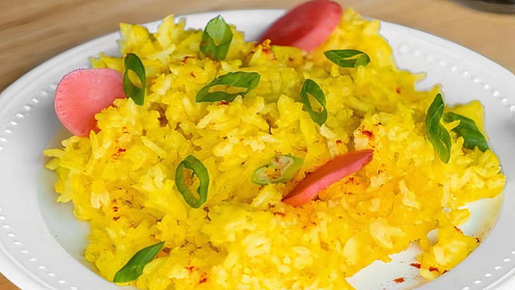 Turmeric Rice · New-crop Jasmine rice seasoned with turmeric and steam in chicken broth.