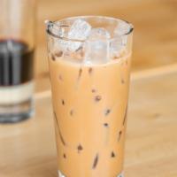 Slow Dripped Iced Coffee · A traditional Vietnamese slow drip dark roast coffee sweetened with condensed milk and poure...