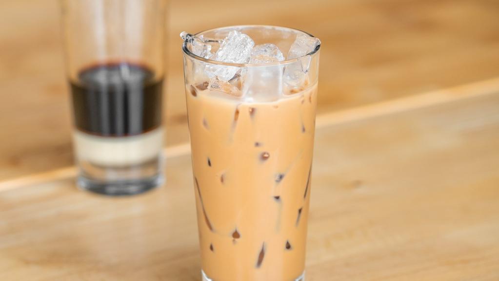 Slow Dripped Iced Coffee · A traditional Vietnamese slow drip dark roast coffee sweetened with condensed milk and poured over ice.