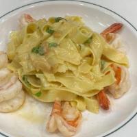 Shrimpi Scampi White · with house-made fettucine with shallot butter sauce
