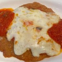 Veal Parmigiana · Breaded veal with tomato sauce and mozzarella. Served with spg marinara.