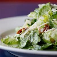 Caesar Salad · Romaine lettuce, tomatoes and shaved parmesan with Caesar dressing and croutons.