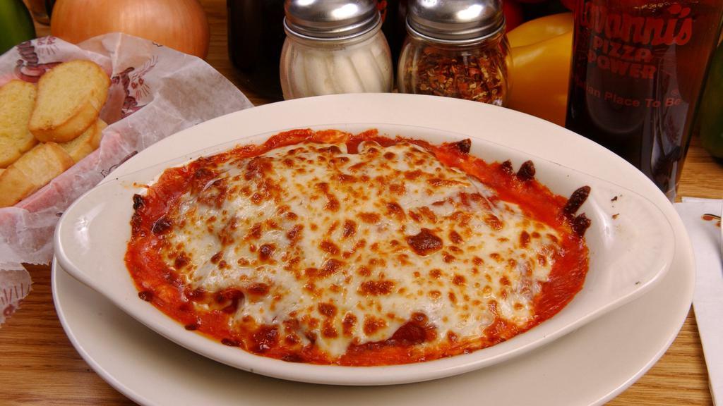 Baked Ravioli With Cheese · Served with meat sauce, baked with provolone mozzarella cheese and 3 pieces of garlic or regular bread